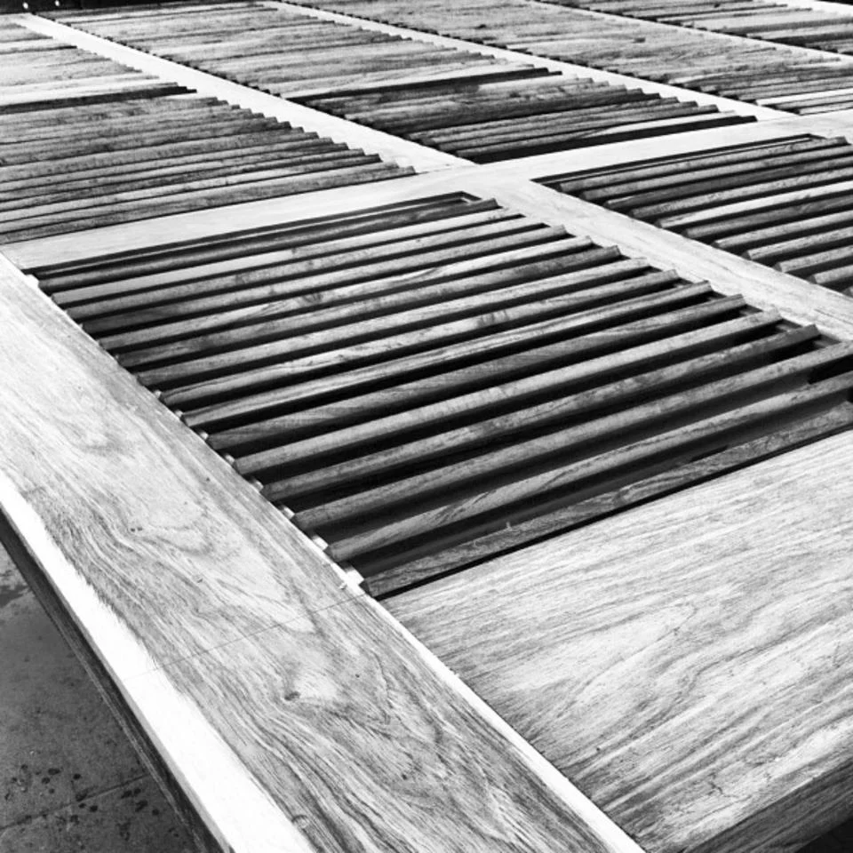 Close-up of louvred timber joinery showing the wood grain and joint detail