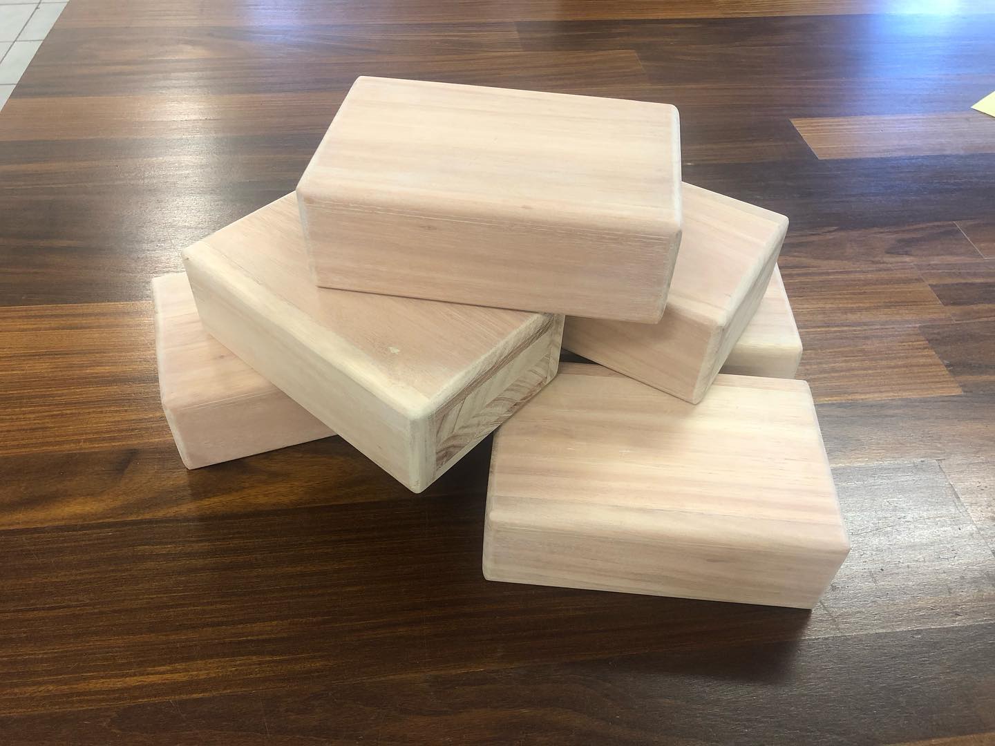 Raw pale timber blocks and offcuts on a workshop floor
