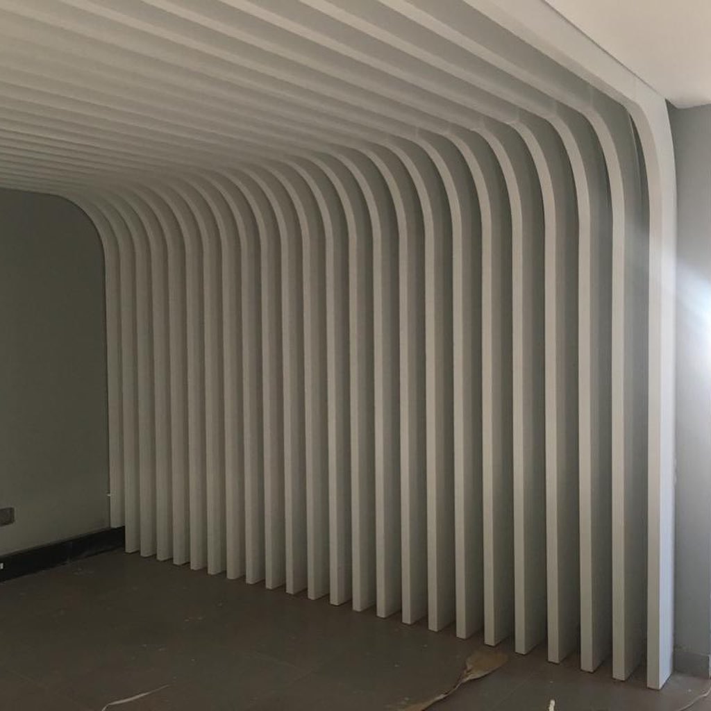 Finished curved timber slat corridor ceiling and wall