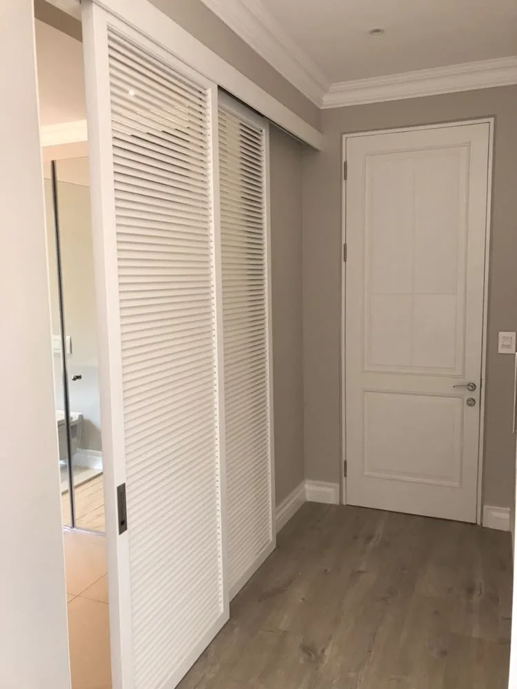 Fairland Residence louvred wardrobe doors in a painted finish