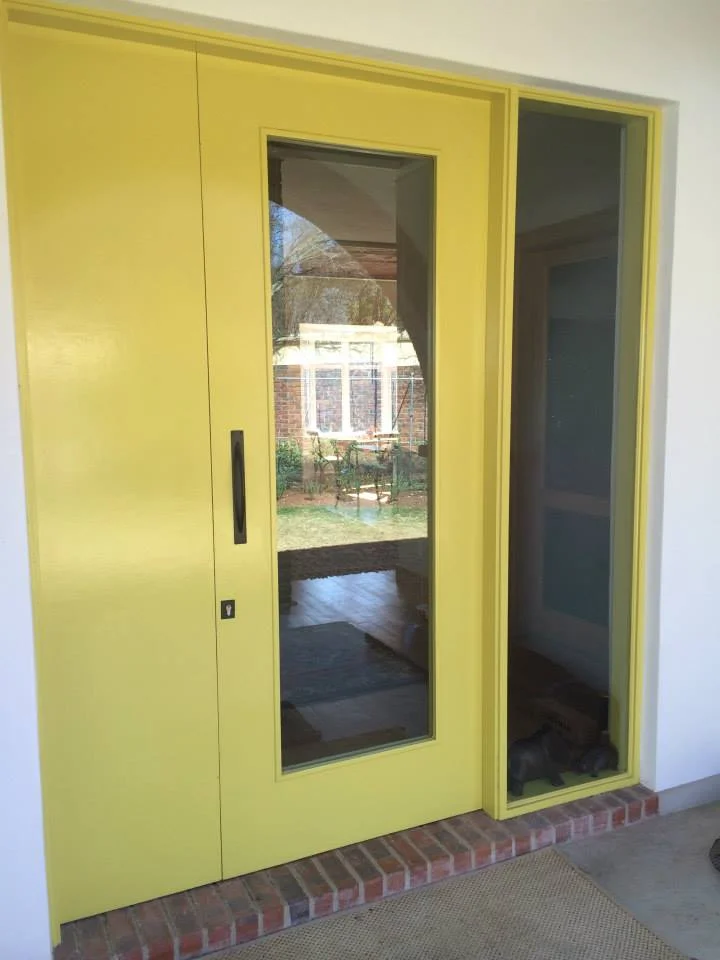 Oaklands Residence front door in a custom painted finish