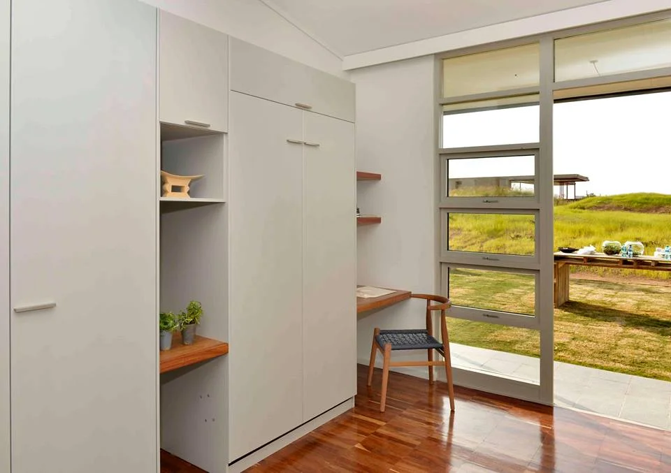 Stand 47 Eco House interior with timber-framed window